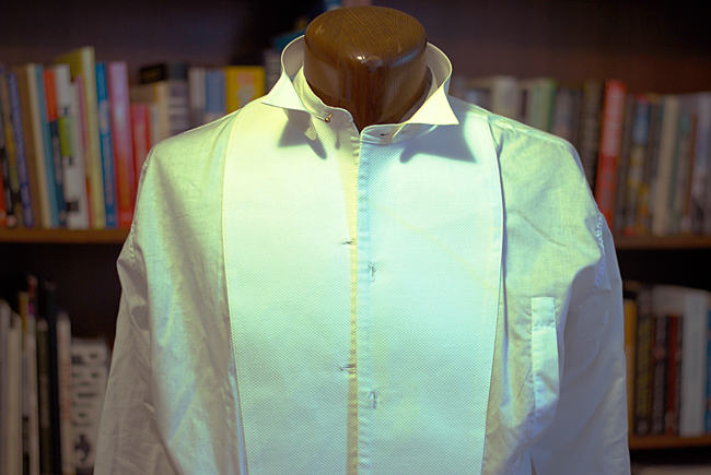 Full dress shirt, featuring stiff piqué front, detachable collar and side access for inserting studs.