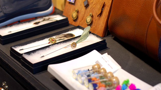 The challenging Hook and Furl lapel pins.